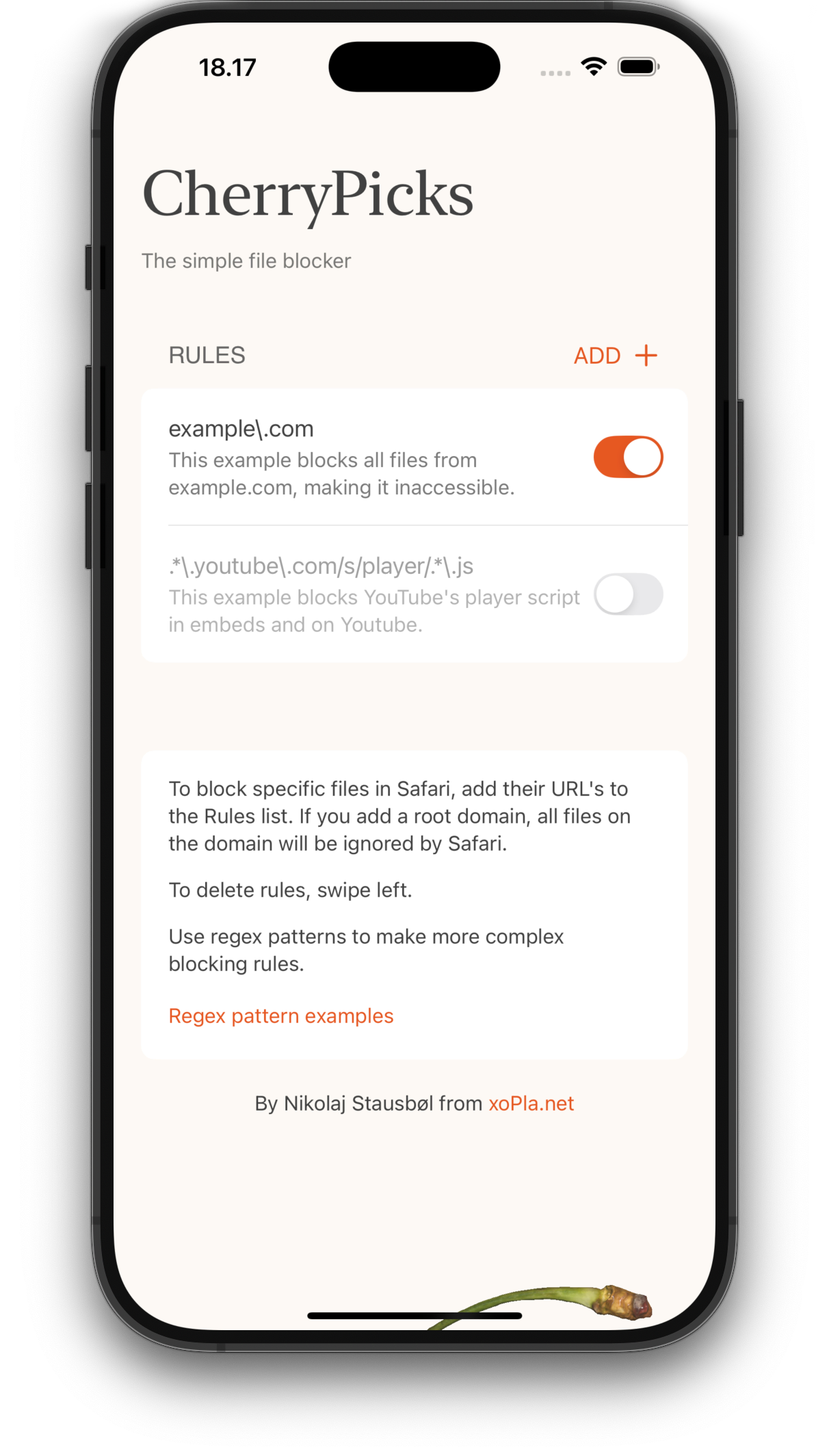 Screenshot of the CherryPicks iOS app interface, showing a minimalist design with a serif logo at the top. Below are example blocking rules, including one for 'example.com' with an orange toggle switch and another for YouTube player scripts. The interface displays instructions for adding URLs and using regex patterns, with a clean white background and gray text. At the bottom is a credit to Nikolaj Stausbøl from xoPla.net.